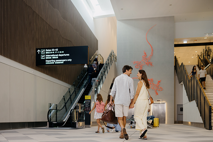Couple walking through airport