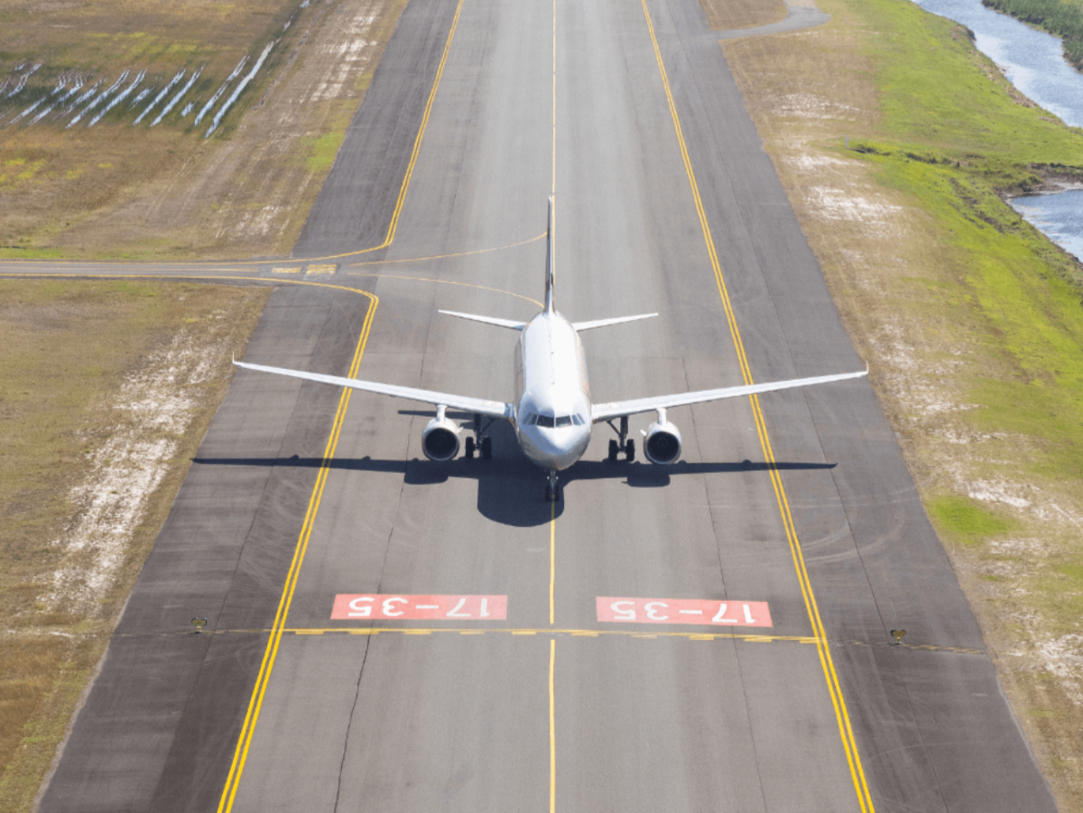 Aircraft positioned on runway, illustrating QAL’s airside infrastructure available for freight and logistics partnerships.