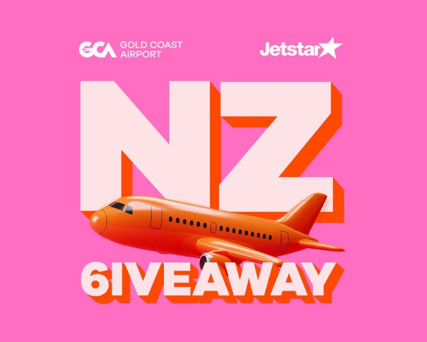 Promotional graphic for Gold Coast Airport and Jetstar NZ Giveaway featuring a bright pink background, bold letters “NZ,” and an orange airplane illustration above the word “Giveaway.<br/>