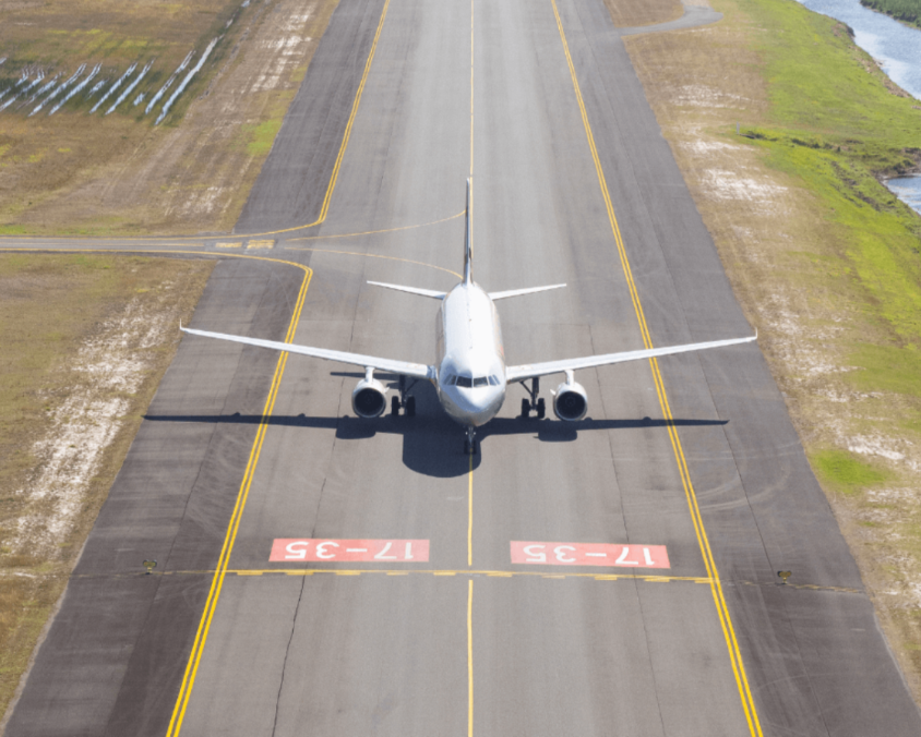 Aircraft positioned on runway, illustrating QAL’s airside infrastructure available for freight and logistics partnerships.
